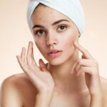 Professional dermatologist consulting patient about skin treatment