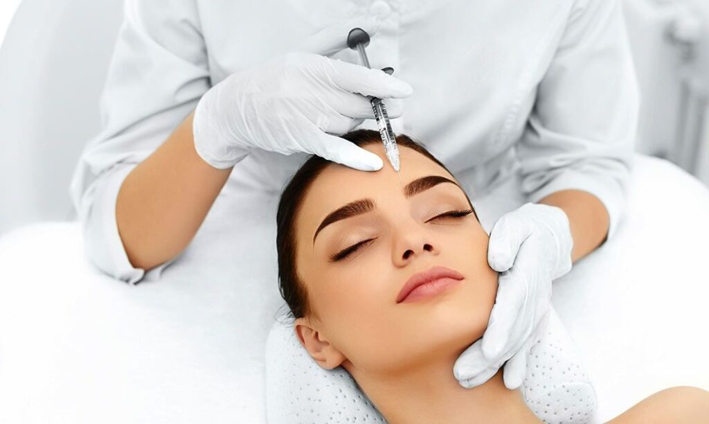 Skin specialist examining a patient for acne and skin conditions
