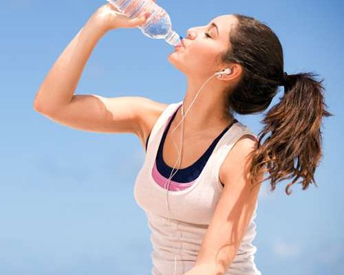 best skin treatment advice in lahore, best skin specialist in lahore, girl drinking water for skin glow and hidration